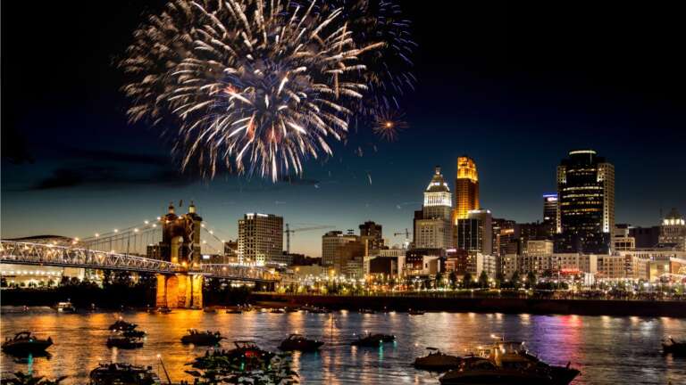 fireworks at night over a city skyline