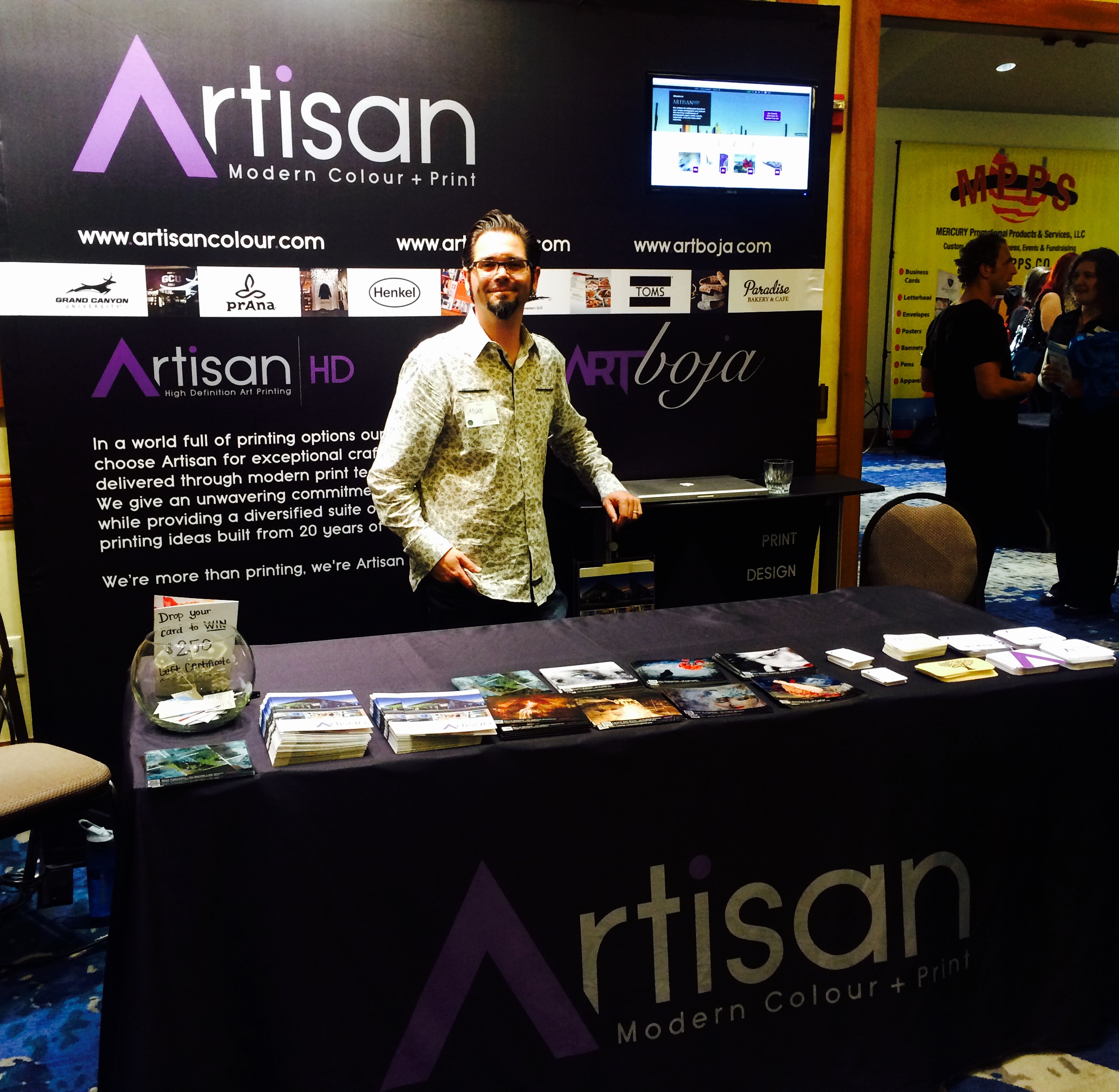 ArtisanHD showing off new booth back-drop at Phoenix Networking Signature Event